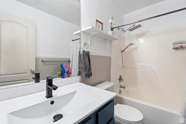 2099 E Hickock Way, Eagle Mountain, UT 84005 - bathroom featuring toilet, wainscoting, vanity, and washtub / shower combination