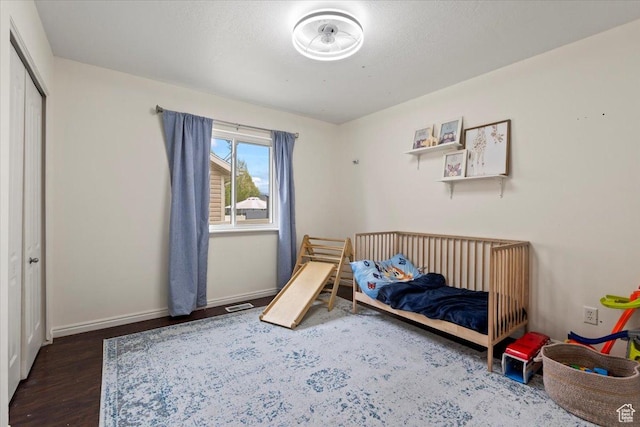 2099 E Hickock Way, Eagle Mountain, UT 84005 - bedroom with wood finished floors, baseboards, and a closet
