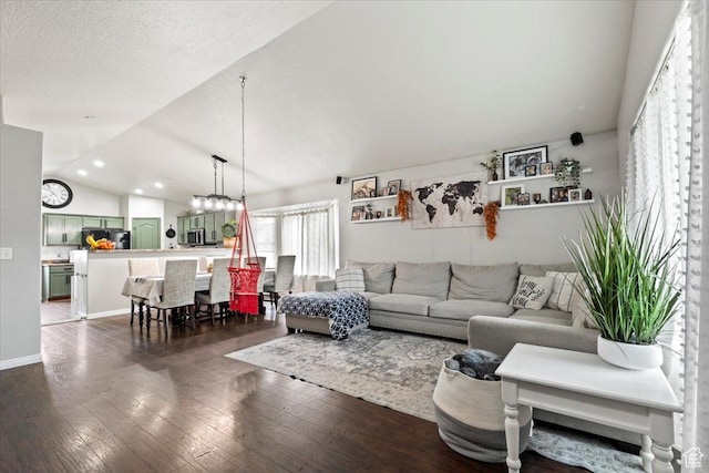2099 E Hickock Way, Eagle Mountain, UT 84005 - living room featuring dark wood finished floors, vaulted ceiling, recessed lighting, and baseboards