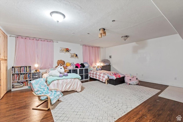 2099 E Hickock Way, Eagle Mountain, UT 84005 - bedroom with wood finished floors and a textured ceiling