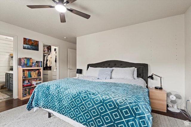 2099 E Hickock Way, Eagle Mountain, UT 84005 - bedroom featuring wood finished floors, connected bathroom, ceiling fan, and a spacious closet