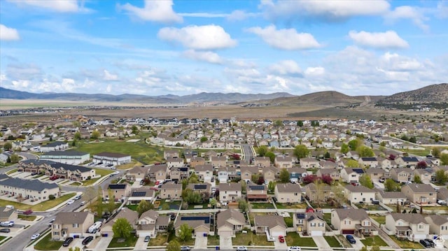 2099 E Hickock Way, Eagle Mountain, UT 84005 - aerial view of property and surrounding area with a mountain backdrop and nearby suburban area