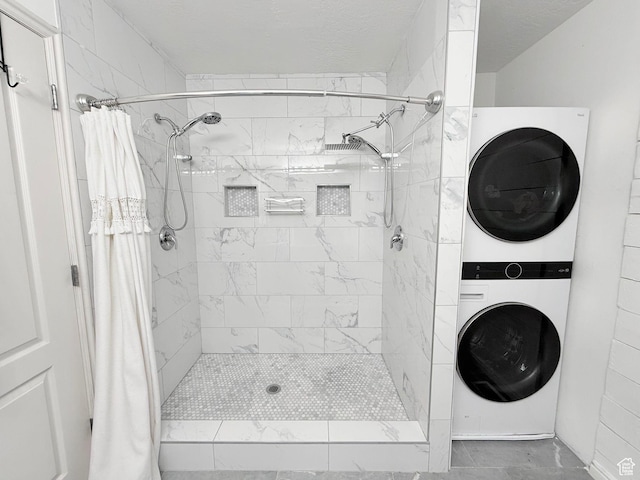 2099 E Hickock Way, Eagle Mountain, UT 84005 - bathroom with stacked washer / dryer and a shower stall