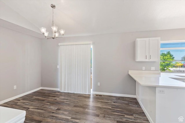 8522 S Kolby Ln, Midvale, UT 84047 - unfurnished dining area featuring a chandelier, dark wood-style flooring, baseboards, and lofted ceiling