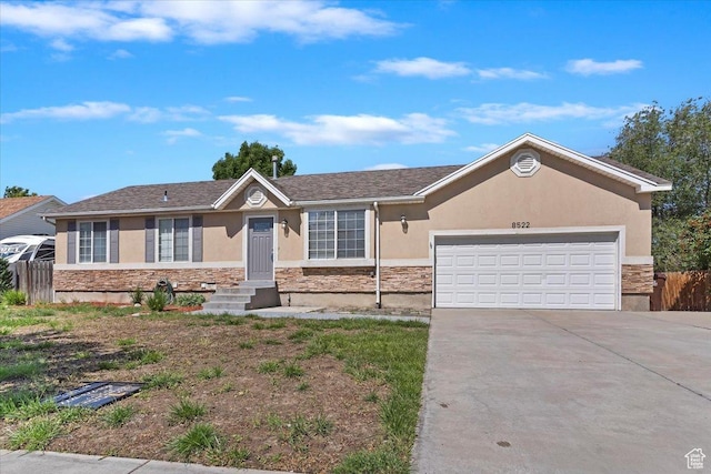 8522 S Kolby Ln, Midvale, UT 84047 - ranch-style home featuring stone siding, stucco siding, driveway, and a garage