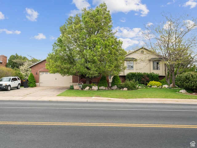 60 N 1000 W, Clearfield, UT 84015 - view of front facade with brick siding, a garage, a front yard, and concrete driveway