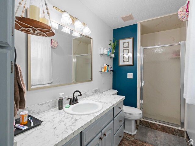 60 N 1000 W, Clearfield, UT 84015 - bathroom featuring a textured ceiling, visible vents, a stall shower, vanity, and toilet
