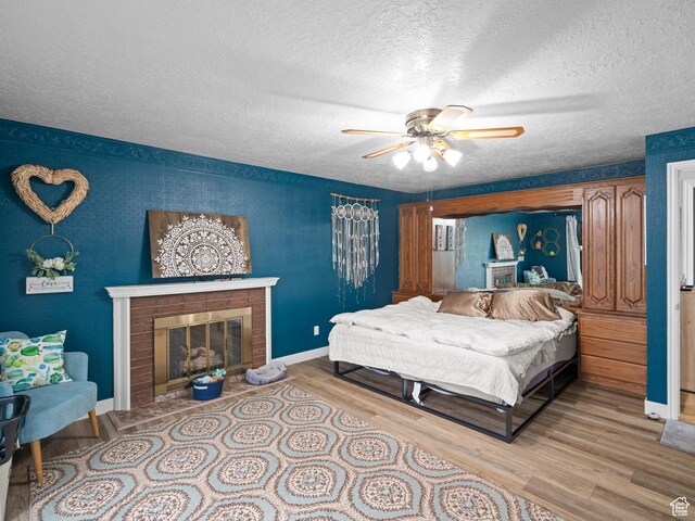60 N 1000 W, Clearfield, UT 84015 - bedroom featuring baseboards, a textured ceiling, and wood finished floors