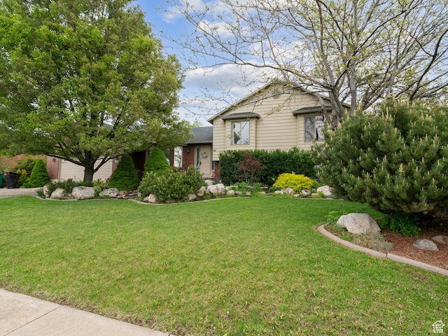 split level home with a front yard