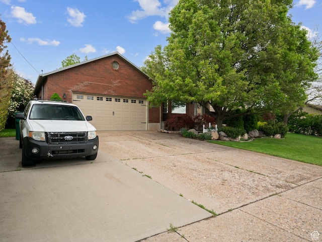60 N 1000 W, Clearfield, UT 84015 - view of front of home featuring a garage, concrete driveway, a front yard, and brick siding