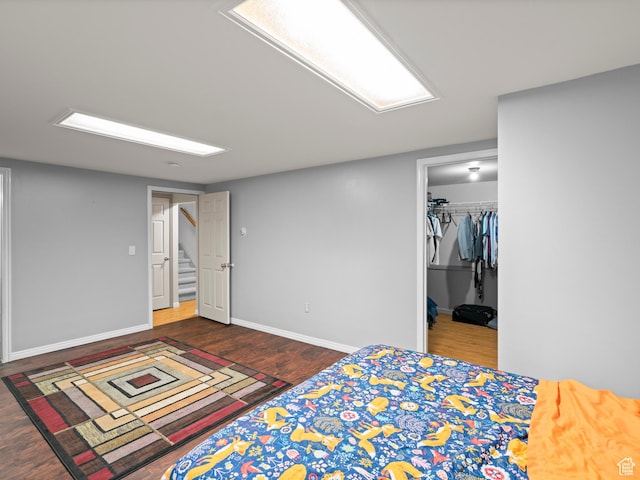 60 N 1000 W, Clearfield, UT 84015 - bedroom with baseboards, a spacious closet, wood finished floors, and a closet