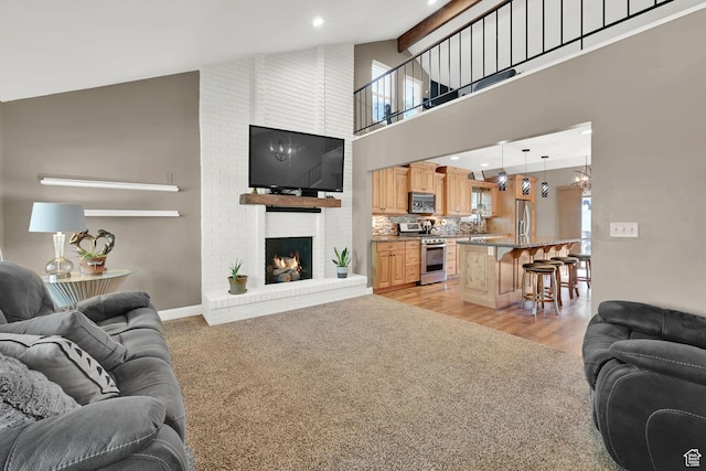 2974 N 1375 E, North Ogden, UT 84414 - living area with a fireplace, baseboards, high vaulted ceiling, recessed lighting, and light wood-style flooring