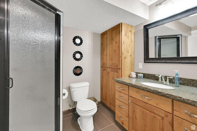 2974 N 1375 E, North Ogden, UT 84414 - full bathroom featuring tile patterned floors, a shower stall, vanity, and toilet