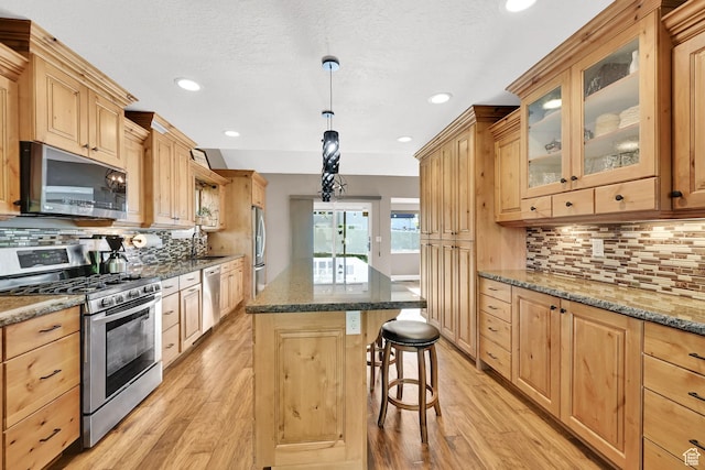 2974 N 1375 E, North Ogden, UT 84414 - kitchen with light brown cabinetry, stainless steel appliances, and light wood-style flooring
