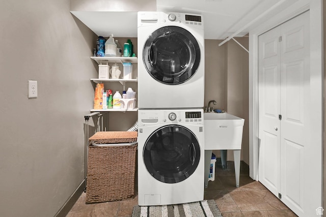 2974 N 1375 E, North Ogden, UT 84414 - washroom with baseboards, laundry area, and stacked washer / dryer