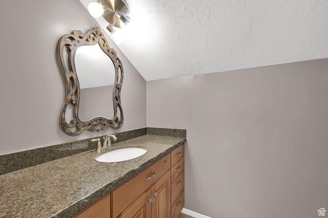 2974 N 1375 E, North Ogden, UT 84414 - bathroom with vanity, a textured ceiling, and lofted ceiling