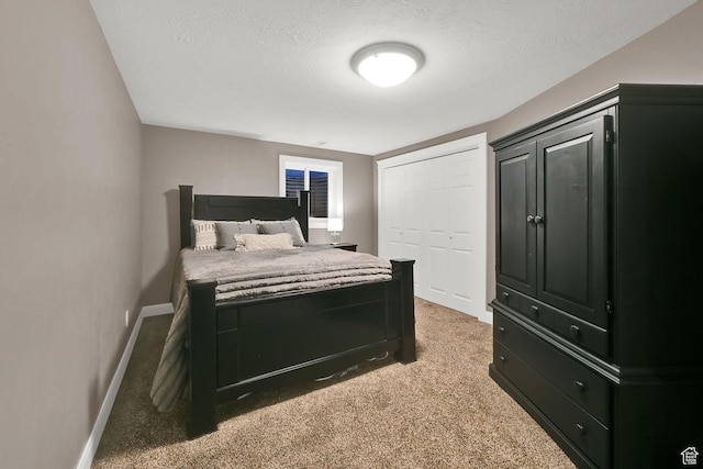 2974 N 1375 E, North Ogden, UT 84414 - bedroom featuring a textured ceiling, baseboards, and light carpet