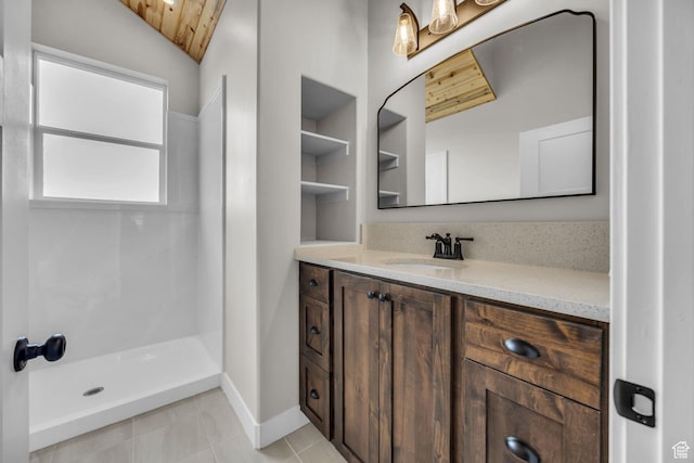 1138 N 1000 E, Mapleton, UT 84664 - bathroom with vanity, a walk in shower, wood ceiling, vaulted ceiling, and baseboards