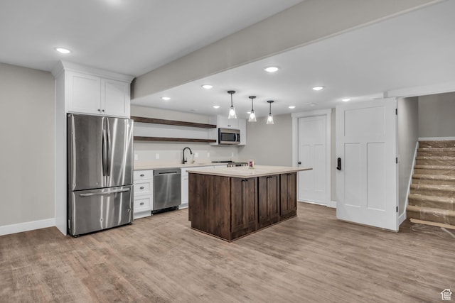 1138 N 1000 E, Mapleton, UT 84664 - kitchen with appliances with stainless steel finishes, open shelves, light countertops, light wood finished floors, and recessed lighting