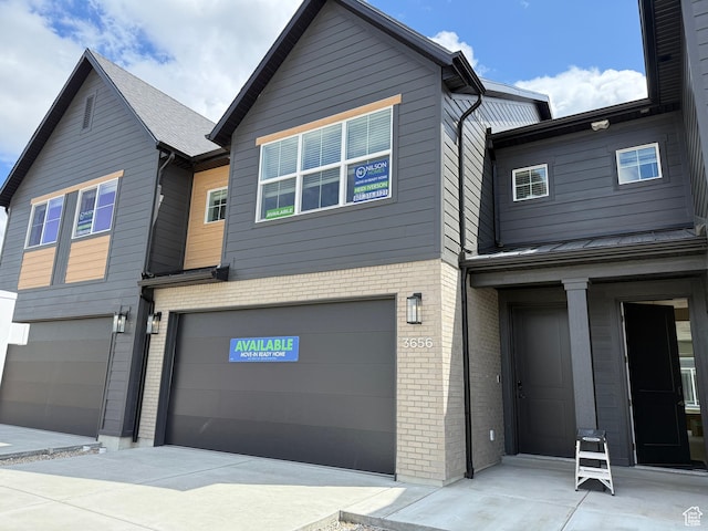 3656 S 4600 W Unit 220, West Haven, UT 84401 - view of front facade with an attached garage and brick siding