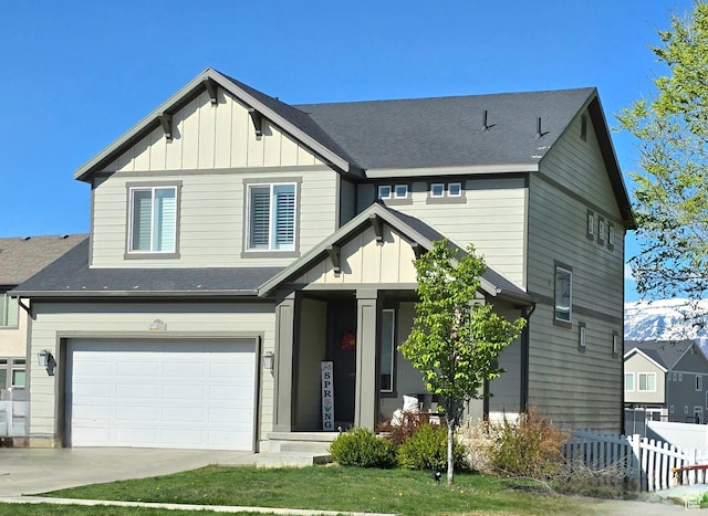 craftsman-style house featuring board and batten siding, fence, concrete driveway, and a garage