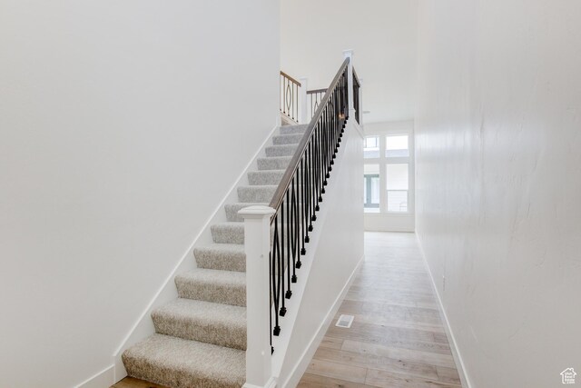 628 W Murray Ln Unit 155, Murray, UT 84123 - stairway featuring baseboards and wood finished floors