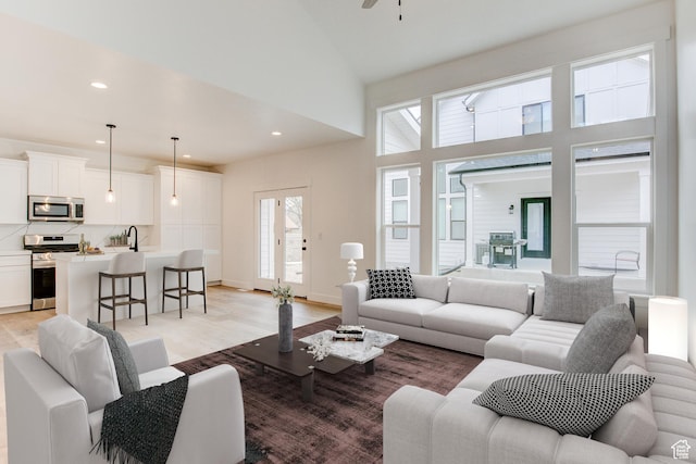 628 W Murray Ln Unit 155, Murray, UT 84123 - living room featuring light wood-style floors, high vaulted ceiling, ceiling fan, and recessed lighting