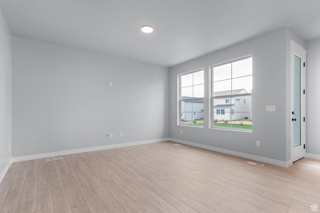 6641 W Spring Snow Ln, Herriman, UT 84096 - empty room with light wood-style floors and baseboards
