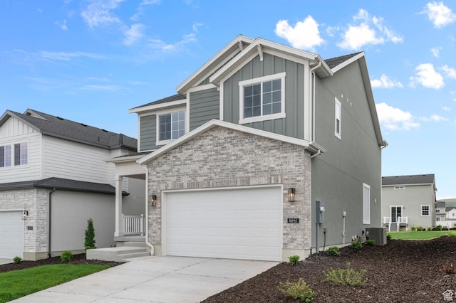 6641 W Spring Snow Ln, Herriman, UT 84096 - view of front of house featuring central air condition unit, board and batten siding, stone siding, and driveway