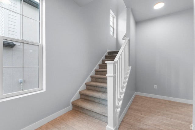 6641 W Spring Snow Ln, Herriman, UT 84096 - staircase with wood finished floors and baseboards