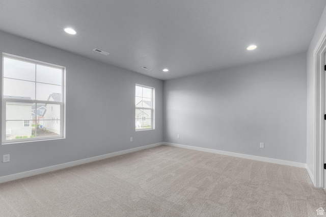 6641 W Spring Snow Ln, Herriman, UT 84096 - empty room featuring light colored carpet, baseboards, and recessed lighting