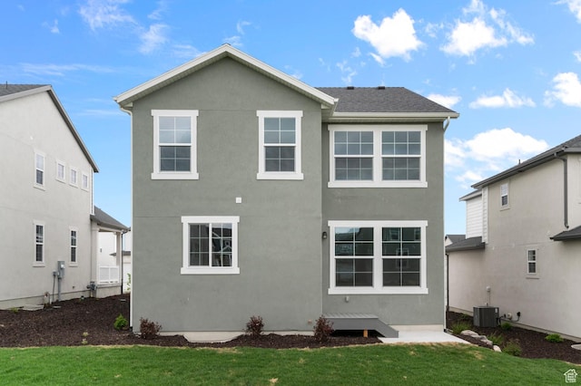 6641 W Spring Snow Ln, Herriman, UT 84096 - back of property featuring a yard, stucco siding, and central AC unit