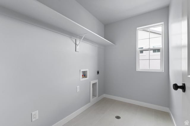 6641 W Spring Snow Ln, Herriman, UT 84096 - washroom with electric dryer hookup, baseboards, washer hookup, and light tile patterned flooring