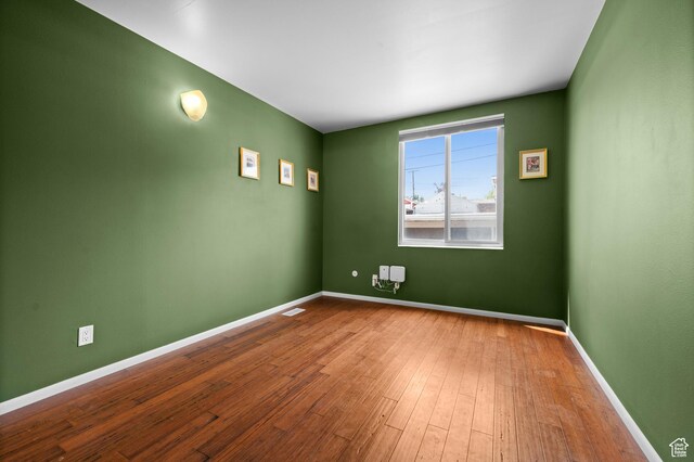229 N B St Unit 4, Salt Lake City, UT 84103 - unfurnished room featuring baseboards, wood finished floors, and visible vents