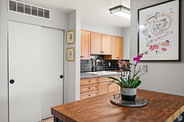 229 N B St Unit 4, Salt Lake City, UT 84103 - kitchen featuring a sink, light brown cabinetry, butcher block counters, and visible vents
