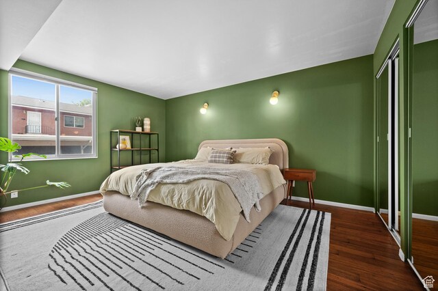 229 N B St Unit 4, Salt Lake City, UT 84103 - bedroom with baseboards, a closet, and wood finished floors