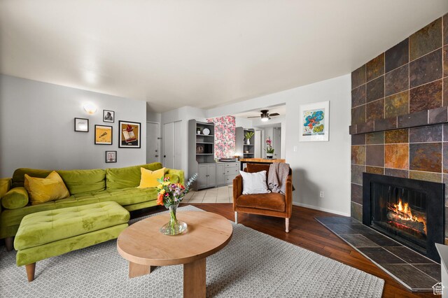 229 N B St Unit 4, Salt Lake City, UT 84103 - living room with baseboards, a ceiling fan, wood finished floors, and a fireplace