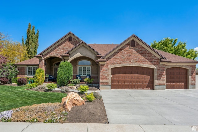 10921 S Renengade View Ln W, South Jordan, UT 84095 - single story home featuring brick siding, a garage, a front lawn, and concrete driveway
