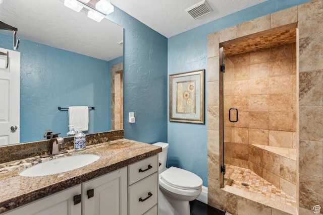 10921 S Renengade View Ln W, South Jordan, UT 84095 - full bathroom with visible vents, a textured wall, toilet, and a shower stall