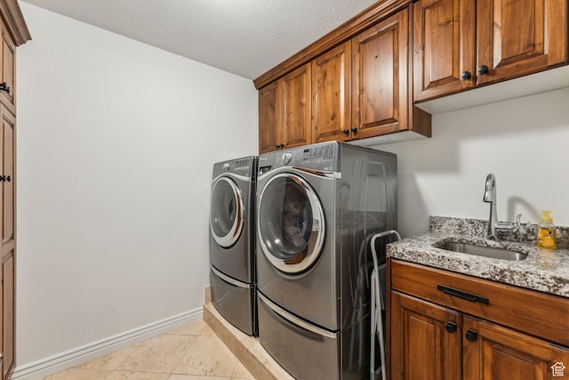10921 S Renengade View Ln W, South Jordan, UT 84095 - laundry room with cabinet space, a sink, separate washer and dryer, baseboards, and light tile patterned floors