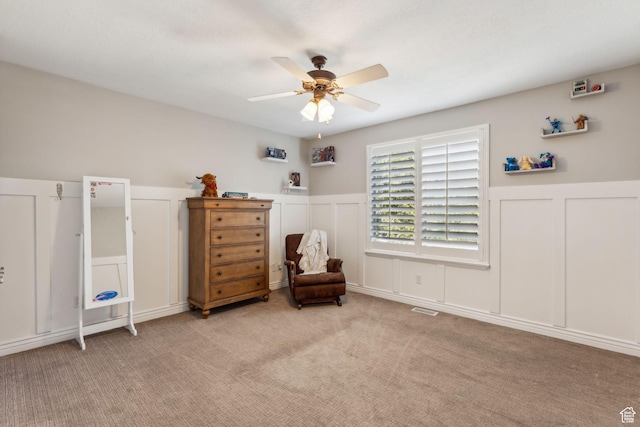 10921 S Renengade View Ln W, South Jordan, UT 84095 - bedroom featuring wainscoting, light carpet, and a decorative wall