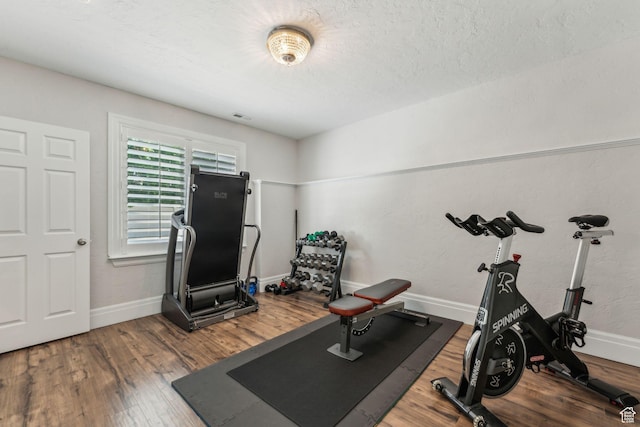 10921 S Renengade View Ln W, South Jordan, UT 84095 - workout room with baseboards, wood finished floors, and visible vents