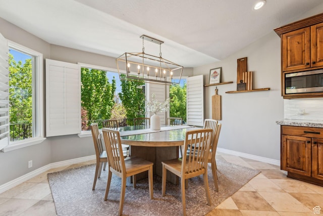 10921 S Renengade View Ln W, South Jordan, UT 84095 - dining space with baseboards, an inviting chandelier, and light tile patterned floors