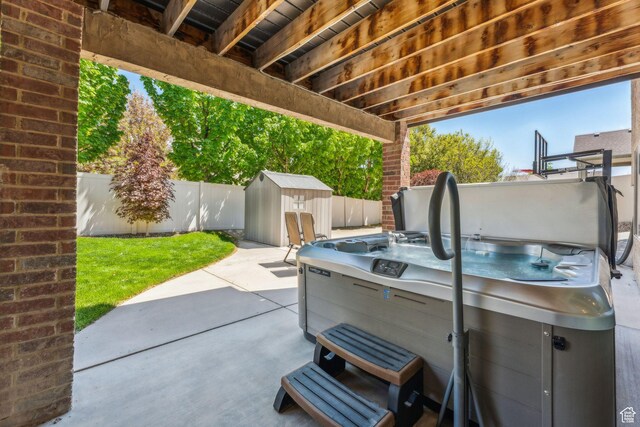 10921 S Renengade View Ln W, South Jordan, UT 84095 - view of patio / terrace with a storage shed, an outbuilding, and a fenced backyard