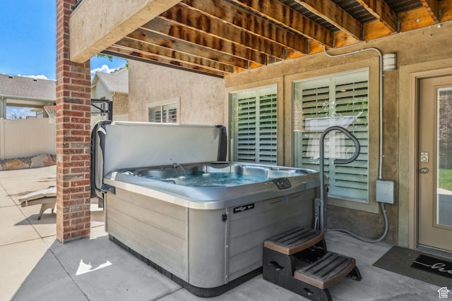 10921 S Renengade View Ln W, South Jordan, UT 84095 - view of patio featuring a hot tub and fence