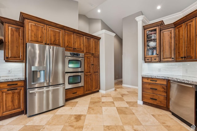 10921 S Renengade View Ln W, South Jordan, UT 84095 - kitchen with light stone counters, baseboards, backsplash, and stainless steel appliances