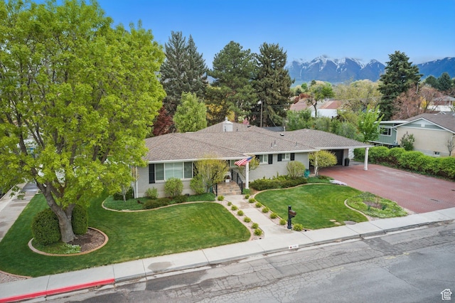 15 S 300 E, Payson, UT 84651 - single story home with a front lawn, a mountain view, driveway, and an attached carport