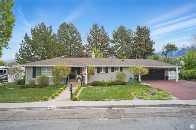 15 S 300 E, Payson, UT 84651 - ranch-style home with an attached garage, brick siding, a front yard, a chimney, and driveway