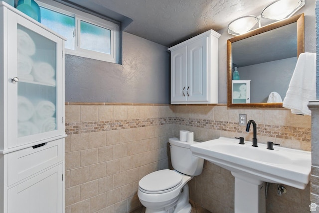 15 S 300 E, Payson, UT 84651 - half bathroom with toilet, tile walls, and a wainscoted wall