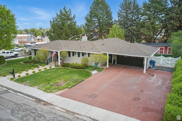 15 S 300 E, Payson, UT 84651 - single story home with a garage, a front lawn, fence, decorative driveway, and a chimney